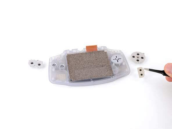 How to Reshell Your Game Boy Advance, Remove the silicone pads: crwdns2935265:013crwdnd2935265:03crwdnd2935265:03crwdne2935265:0