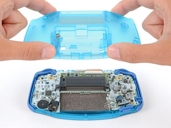 How to Reshell Your Game Boy Advance, Install the back shell: crwdns2935265:033crwdnd2935265:02crwdnd2935265:03crwdne2935265:0