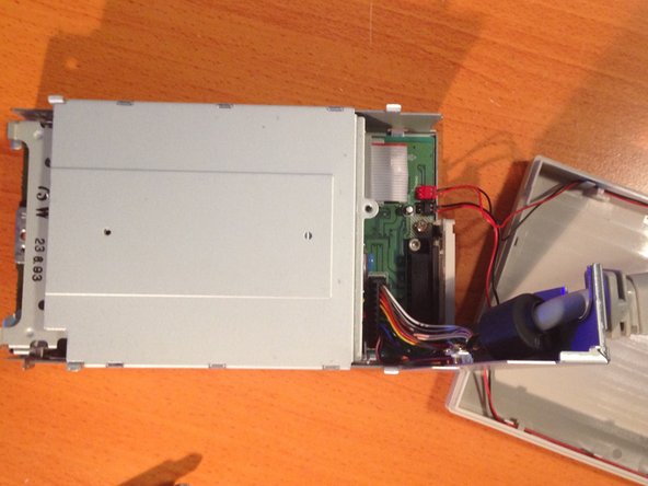 Apple 3.5 Drive External Floppy Drive Teardown, Removing the Rear Chassis Cover and External Cable: crwdns2935265:05crwdnd2935265:02crwdnd2935265:03crwdne2935265:0
