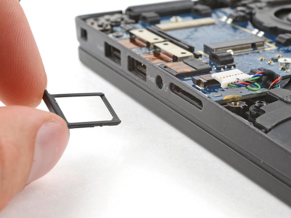 Dell Latitude 7410 I/O Board Replacement, Remove the SIM card tray: crwdns2935265:015crwdnd2935265:03crwdnd2935265:03crwdne2935265:0