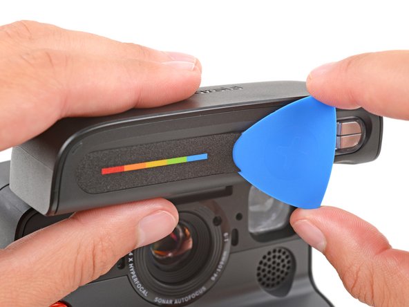 Polaroid Flash Unit Shell Replacement, Remove the screw cover: crwdns2935265:03crwdnd2935265:02crwdnd2935265:03crwdne2935265:0