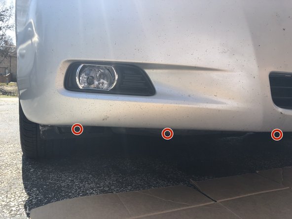 2009 Toyota Camry SE Fog light bulb, lamp, and housing Replacement, Remove the plastic underside shield: step 3, image 1 of 3