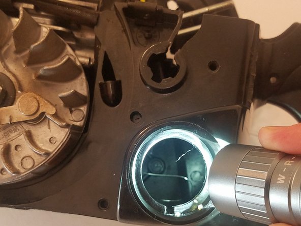 Use a pair of long needle nose pliers or hemostats to grab the other end through the gas tank