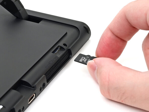 Nintendo Switch 2 Microphone Replacement, Open the kickstand: crwdns2935265:011crwdnd2935265:03crwdnd2935265:03crwdne2935265:0