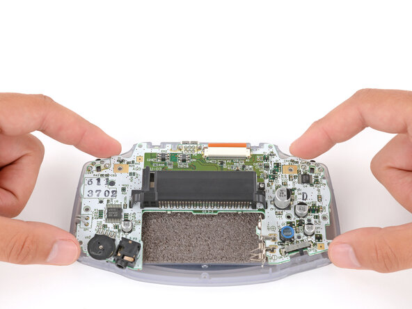Game Boy Advance LCD Screen Replacement, Reposition the motherboard: crwdns2935265:010crwdnd2935265:01crwdnd2935265:03crwdne2935265:0