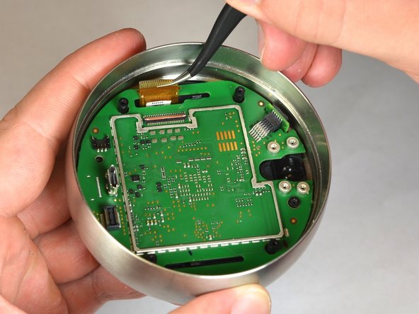 Nest Learning Thermostat 2nd Generation LCD Screen Replacement, Disconnect the LCD ribbon from the motherboard: crwdns2935265:013crwdnd2935265:02crwdnd2935265:02crwdne2935265:0