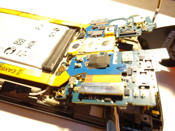 LG G2 Rear Camera Replacement, Gently tilt up motherboard, careful to watch 4x flex cables: 8 단계, 이미지 2개 중 2개