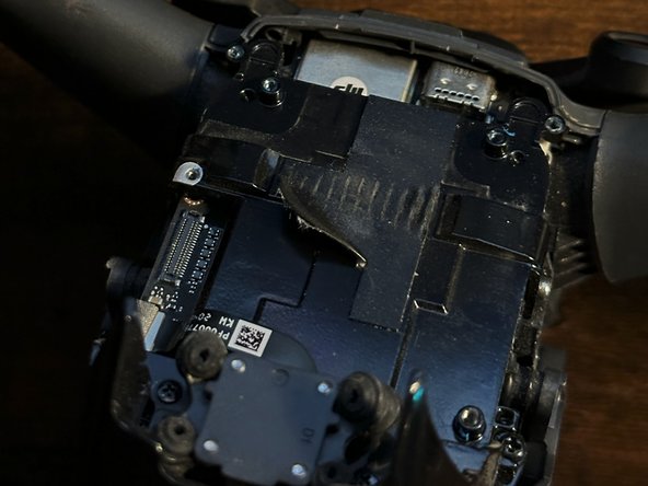 DJI FPV Drone Camera/Gimbal Replacement, Remove the cable cover: crwdns2935265:019crwdnd2935265:02crwdnd2935265:03crwdne2935265:0