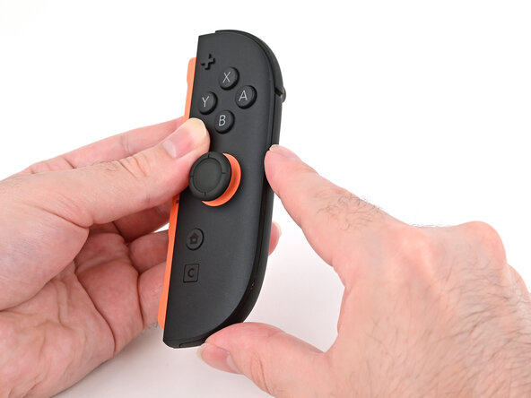 Joy-Con 2 (Right) Joystick Replacement, Install the plastic strip: crwdns2935265:049crwdnd2935265:03crwdnd2935265:03crwdne2935265:0