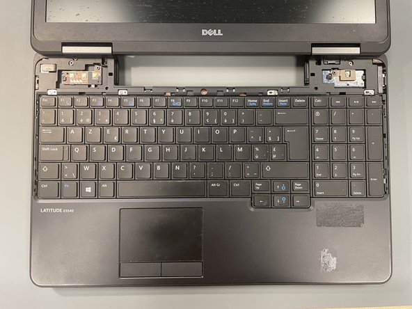 Dell Latitude E5540 Disassembly, Remove the Top Panel: crwdns2935265:08crwdnd2935265:03crwdnd2935265:03crwdne2935265:0