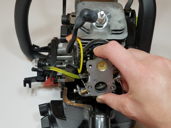 Slide the carburetor back off of the mounting bolts