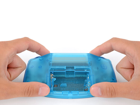 How to Reshell Your Game Boy Advance, Install the back shell: crwdns2935265:033crwdnd2935265:03crwdnd2935265:03crwdne2935265:0