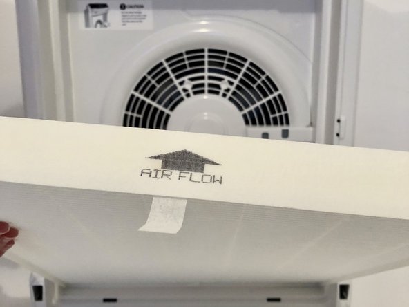 The arrow on the top of the True HEPA Filter should point towards the device and away from you.