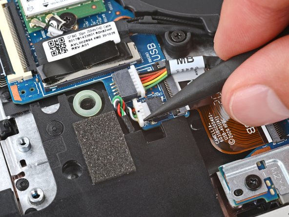 HP EliteBook 845 G7 Smart Card Reader Replacement, Disconnect the left speaker: crwdns2935265:010crwdnd2935265:02crwdnd2935265:03crwdne2935265:0