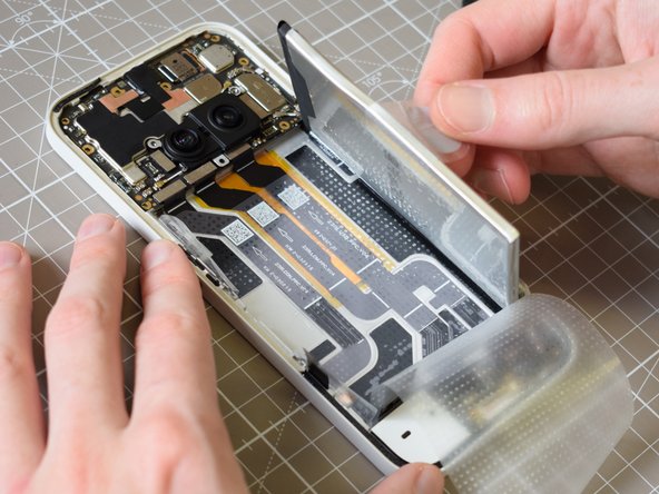 Nothing Phone (2a) Battery Replacement, Lift the battery out left side first: crwdns2935265:019crwdnd2935265:03crwdnd2935265:03crwdne2935265:0