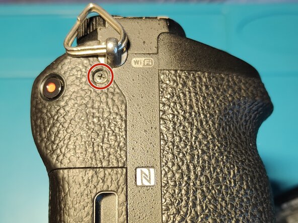 Sony A7 II Top Flex Cable replacement, Removing screws holding the front cover: crwdns2935265:05crwdnd2935265:03crwdnd2935265:03crwdne2935265:0