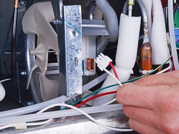 Whirlpool Refrigerator Condenser Fan Replacement, Disconnect the condenser fan: crwdns2935265:04crwdnd2935265:02crwdnd2935265:02crwdne2935265:0
