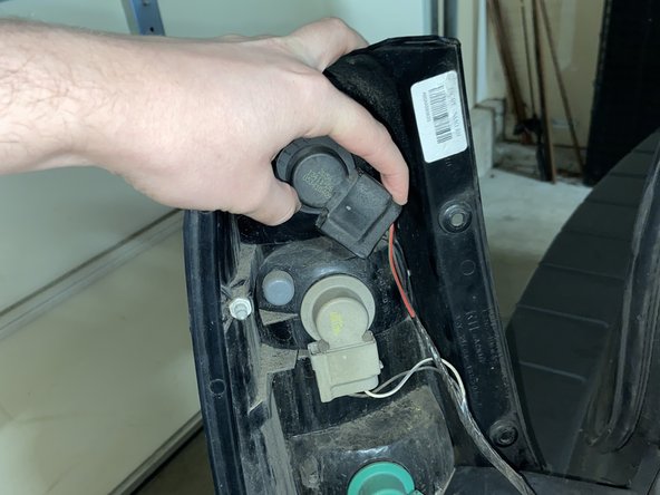How to Replace a Brake Light for a 2006 Ford Escape Hybrid: step 7, image 2 of 3