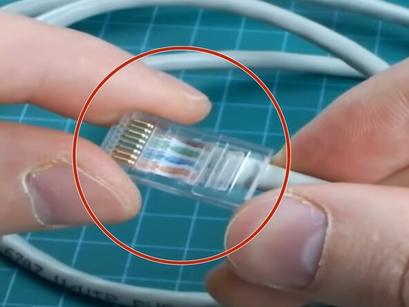 How to Crimp an Ethernet Cable (RJ45), Insert Wires into the Connector: passo 5, immagine 1 di 2
