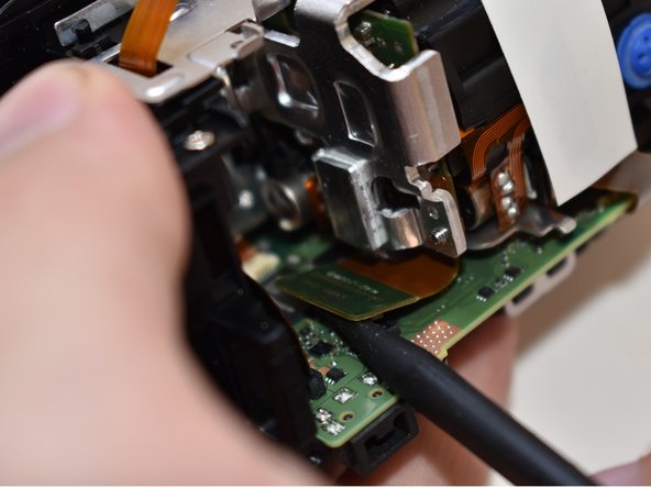 Canon Vixia HF R62 Display Panel Replacement, Central Capturing Unit: crwdns2935265:020crwdnd2935265:03crwdnd2935265:03crwdne2935265:0