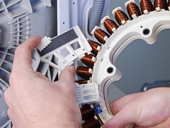 LG Front Load Washing Machine Stator Replacement, Remove the rotor position sensor: crwdns2935265:011crwdnd2935265:03crwdnd2935265:03crwdne2935265:0