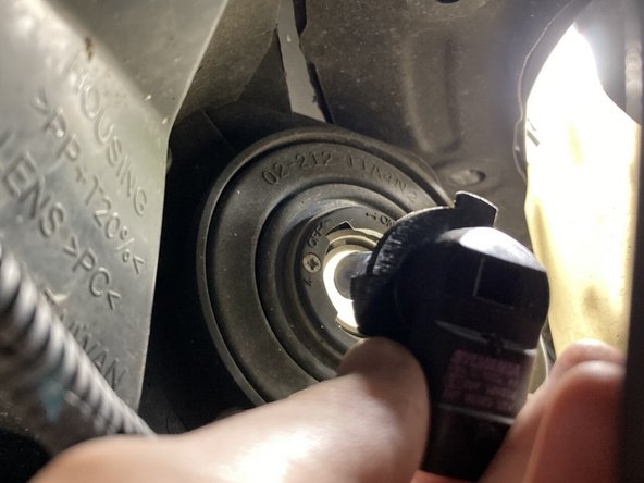 Pull the bulb toward you to remove it.