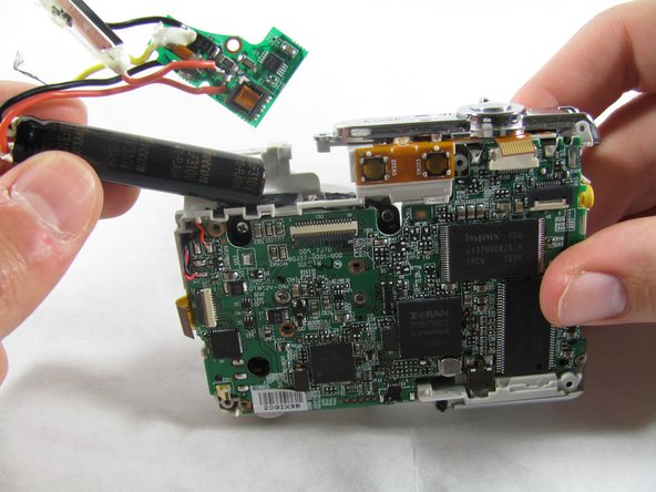 Removing Olympus FE-210 Flash Assembly: crwdns2935265:011crwdnd2935265:03crwdnd2935265:03crwdne2935265:0