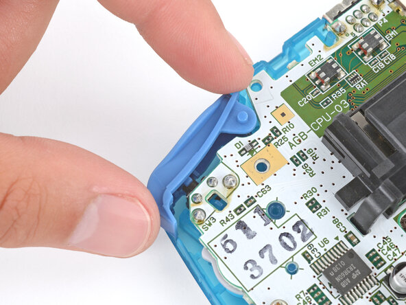 How to Reshell Your Game Boy Advance, Install the shoulder buttons: crwdns2935265:031crwdnd2935265:03crwdnd2935265:03crwdne2935265:0