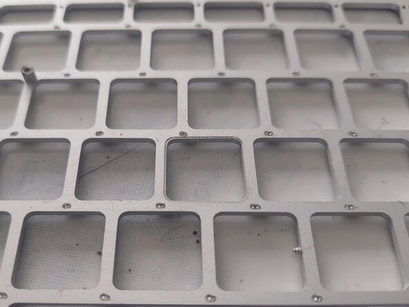 MacBook Air 11" Early 2014 Keyboard Replacement, Remove any remaining rivets & dirt: crwdns2935265:05crwdnd2935265:02crwdnd2935265:03crwdne2935265:0