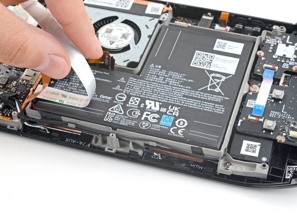 Steam Deck Battery Replacement, Peel back the button board cable: crwdns2935265:013crwdnd2935265:02crwdnd2935265:03crwdne2935265:0