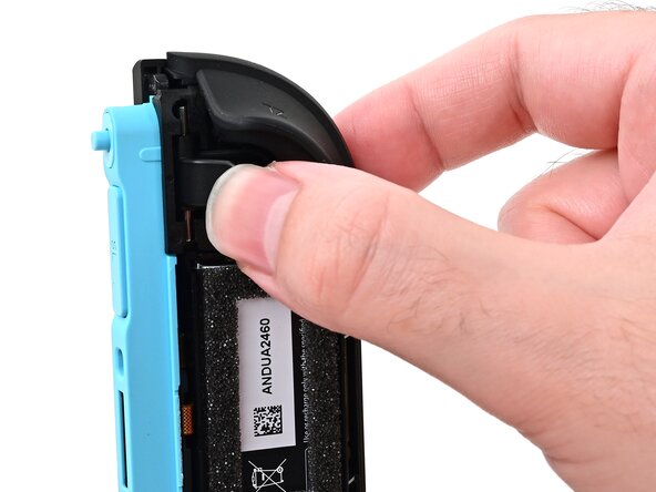 Joy-Con 2 (Left) Joystick Replacement, Install the release button: crwdns2935265:048crwdnd2935265:03crwdnd2935265:03crwdne2935265:0