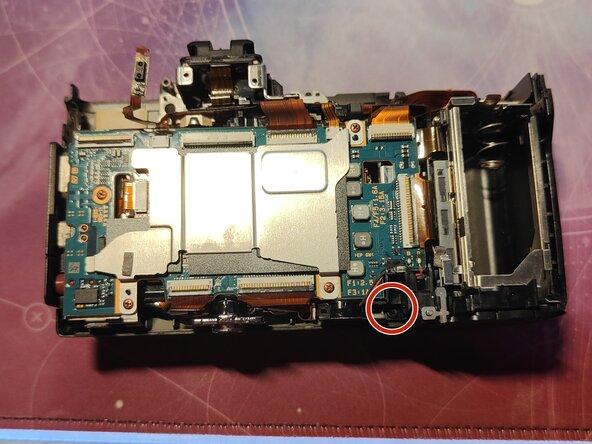 Sony NEX-7 Sony NEX-7 Shutter Assembly Replacement, Remove battery door assembly: step 30, image 1 of 3