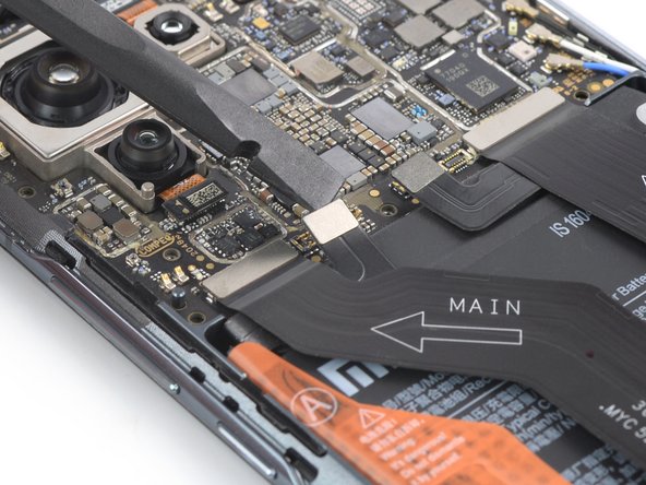 Mi 11 Screen Replacement, Disconnect the left battery cable: crwdns2935265:016crwdnd2935265:02crwdnd2935265:02crwdne2935265:0