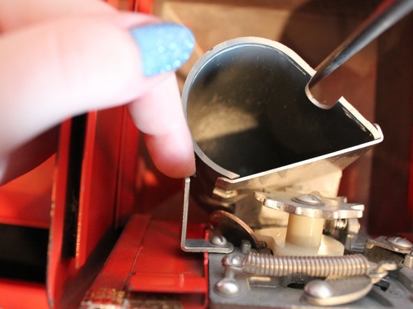 How to Fix a Stuck Quarter in a  Candy Machine: step 6, image 2 of 3