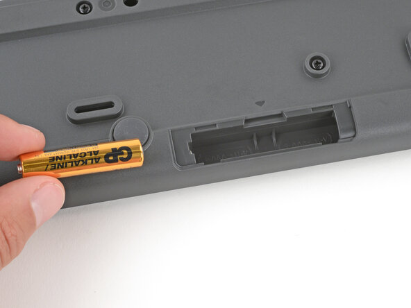 How to Open Your Logitech K295 Keyboard, Remove the batteries: crwdns2935265:03crwdnd2935265:03crwdnd2935265:03crwdne2935265:0