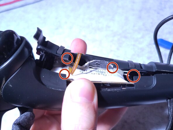 Valve Index Controller Right Index Controller Battery Replacement, Remove the adhesive, then the battery: crwdns2935265:04crwdnd2935265:03crwdnd2935265:03crwdne2935265:0