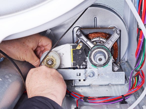 Whirlpool WED87HED Dryer Hi-Limit Thermostat/Inlet Thermistor Testing and Replacement, Release the belt tension: crwdns2935265:036crwdnd2935265:03crwdnd2935265:03crwdne2935265:0