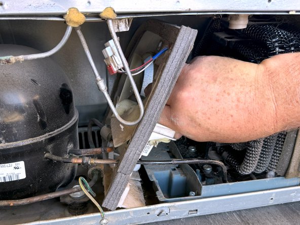 Samsung Older French Door Refrigerator Condenser Fan Replacement, Rotate the fan bracket to free it: step 7, image 2 of 3