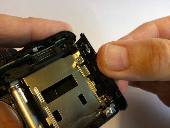 Panasonic Lumix DMC-TZ35 Top assembly removal/replacement, Removing the side panels: crwdns2935265:09crwdnd2935265:02crwdnd2935265:03crwdne2935265:0