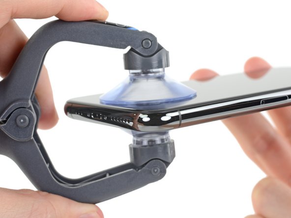 The next two steps demonstrate the iSclack, a handy tool that we recommend for anyone doing frequent repairs. If you aren't using the iSclack, skip down two steps for an alternate method.