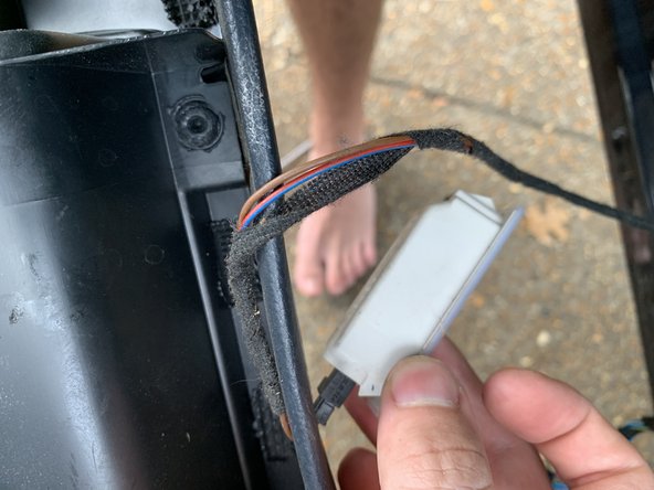 Pop the light out of the bottom of the door panel and then unplug it.