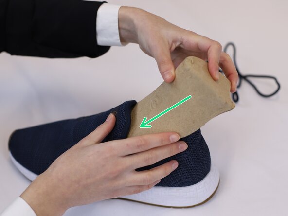 How to Clean Mesh Shoes, Remove the laces and insert a shoe model or paper: crwdns2935265:03crwdnd2935265:03crwdnd2935265:03crwdne2935265:0