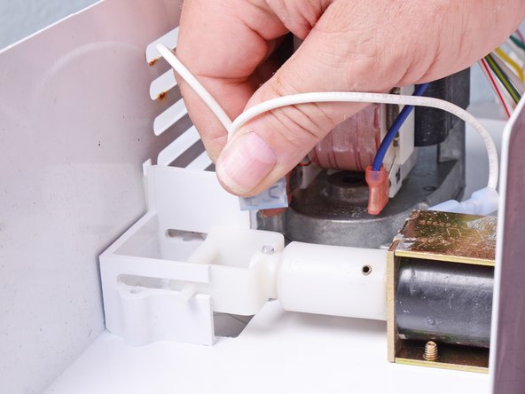 Whirlpool Older Model Side‑By‑Side Refrigerator  Auger Motor Replacement, Disconnect the auger motor: step 10, image 2 of 3