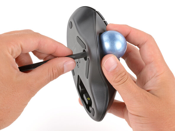 How to Open Your Logitech Ergo M575S, Remove the trackball: crwdns2935265:04crwdnd2935265:03crwdnd2935265:03crwdne2935265:0