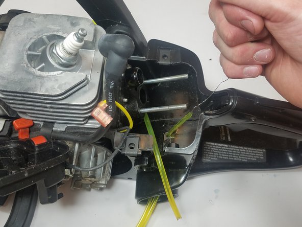 Attach the wire to the cut end of the thinner diameter fuel line as in the previous step