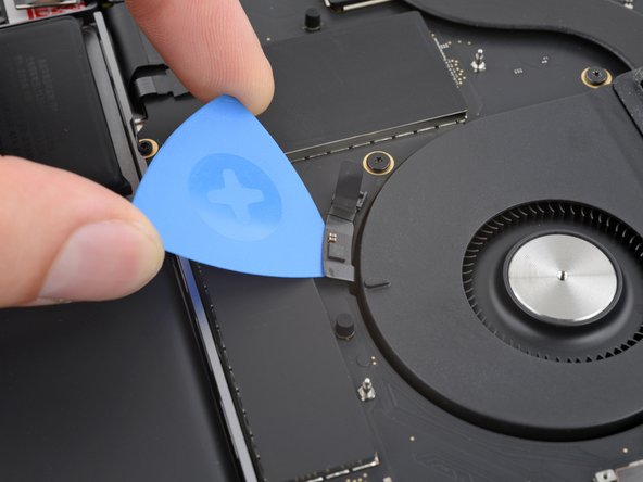 MacBook Pro 14" Late 2023 (M3) USB-C Ports Replacement, Separate the fan cable adhesive: crwdns2935265:038crwdnd2935265:02crwdnd2935265:02crwdne2935265:0