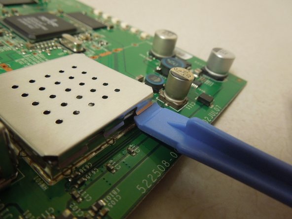 Motorola SURFboard SB5101 Metal Receiver Replacement, Pivoting the Prying Tool: crwdns2935265:07crwdnd2935265:02crwdnd2935265:02crwdne2935265:0