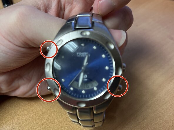 Fossil AM-3314 Battery Replacement, Hold the 3 pusher buttons at the same time to reset the watch: step 4, image 1 of 1