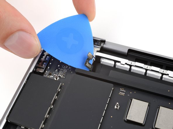 MacBook Pro 14" Late 2023 (M3) USB-C Ports Replacement, Separate the touch ID sensor cable: crwdns2935265:049crwdnd2935265:02crwdnd2935265:02crwdne2935265:0