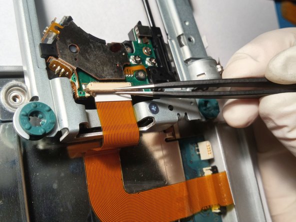 Sony Playstation 2 SCPH-77004 Laser Replacement, Unscrewing the Drive: crwdns2935265:012crwdnd2935265:02crwdnd2935265:03crwdne2935265:0